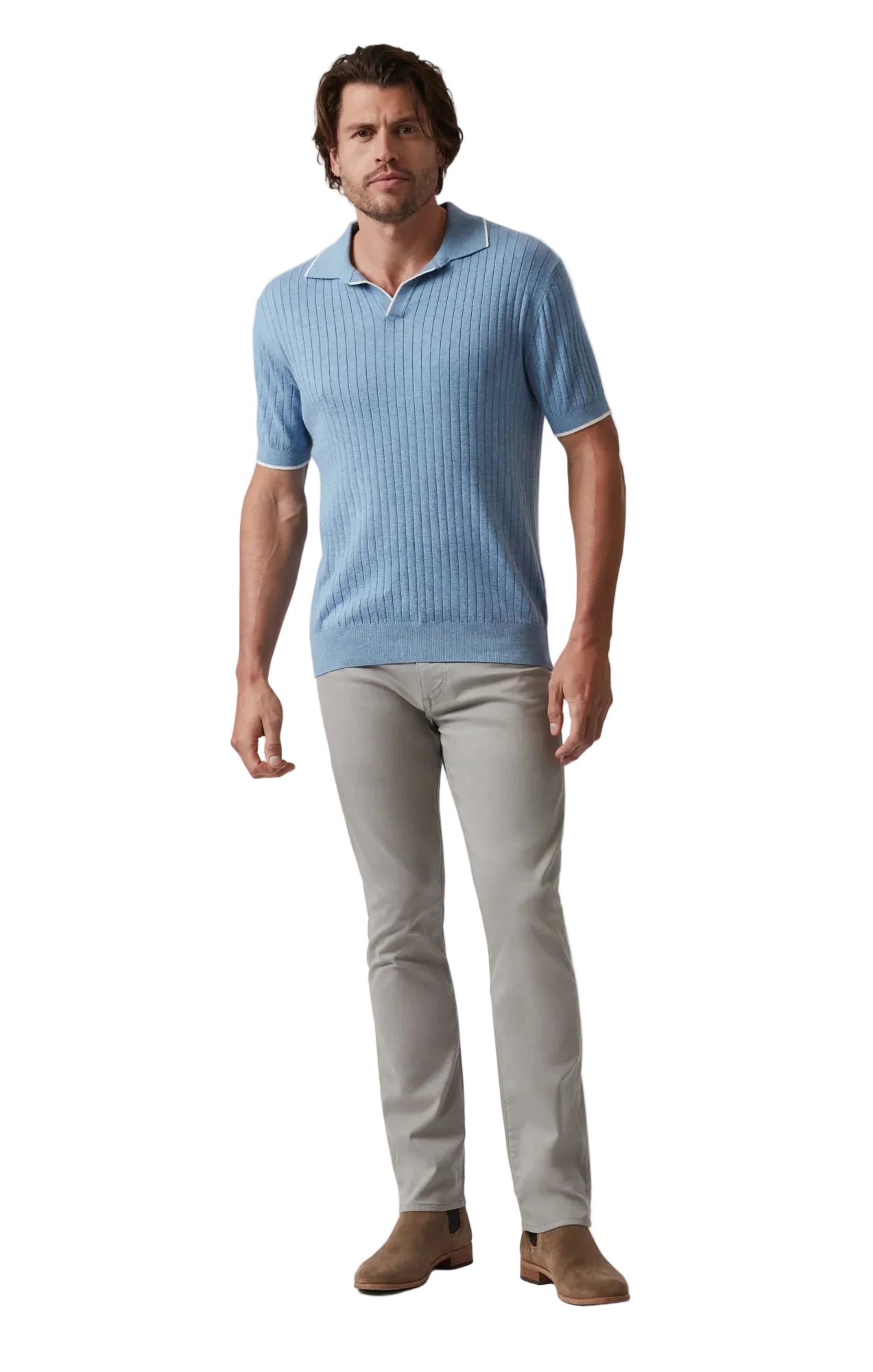 Man wearing a blue ribbed polo shirt and gray pants on a white background