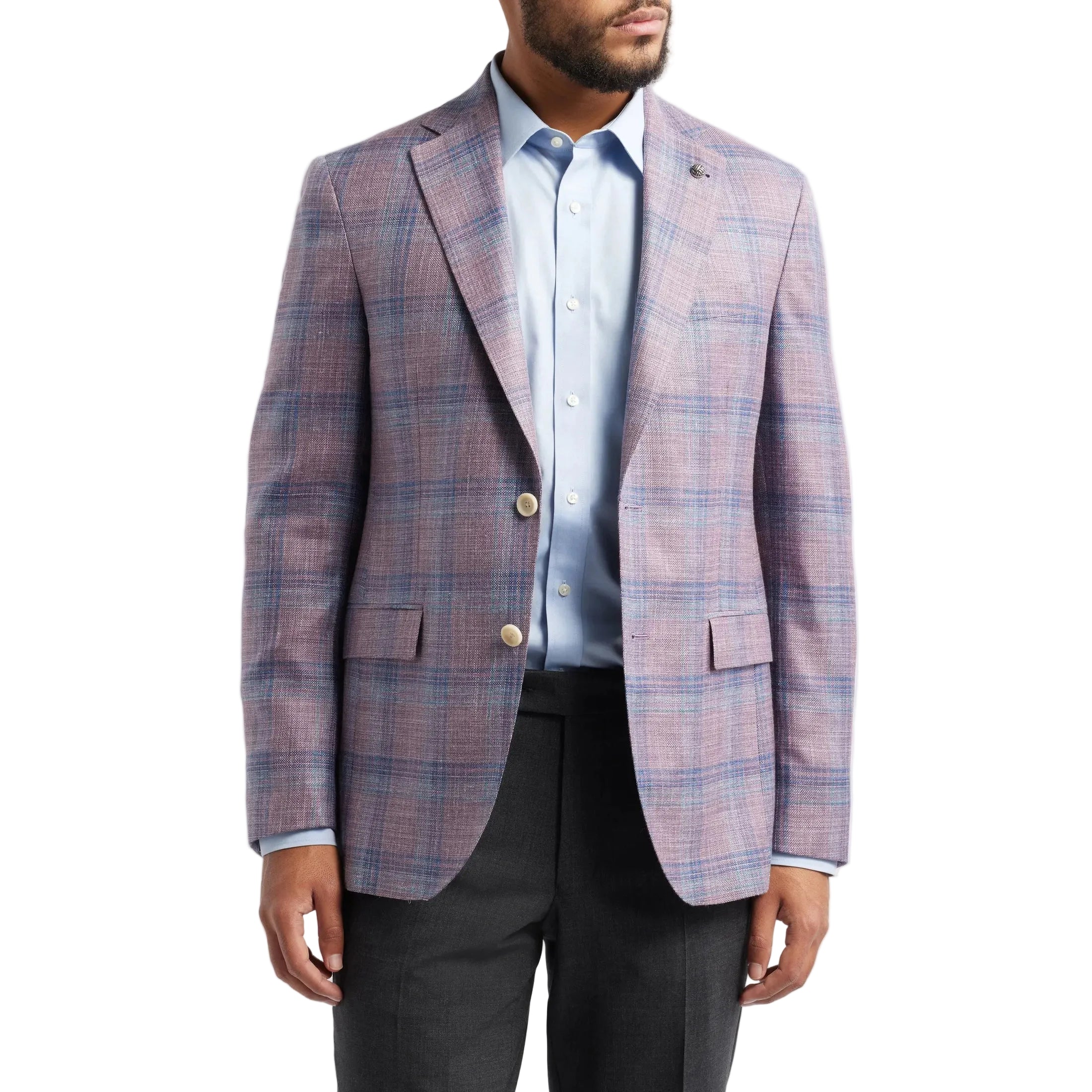 Man wearing a plaid blazer over a shirt with a white background