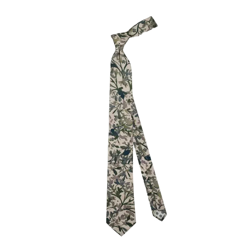A necktie with an all-over botanical pattern in muted green, navy, and beige tones, displayed on a clean light gray background.
