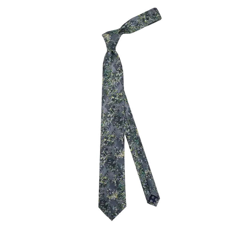 Black patterned tie on a light gray background