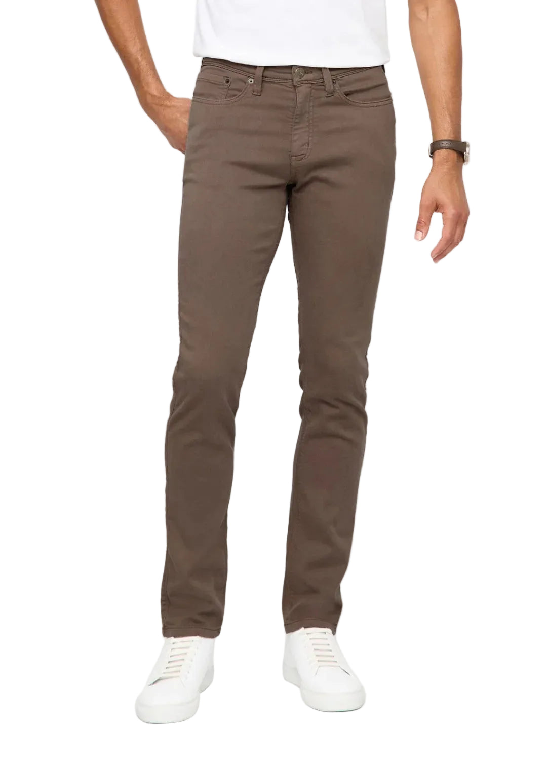 Person wearing brown pants and white shoes on a white background