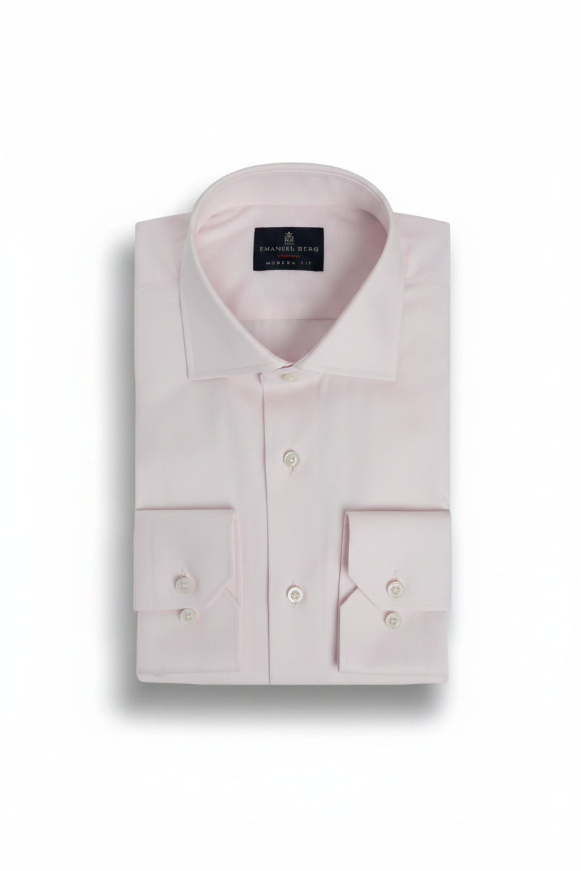 Pink dress shirt with a collar label on a light gray background